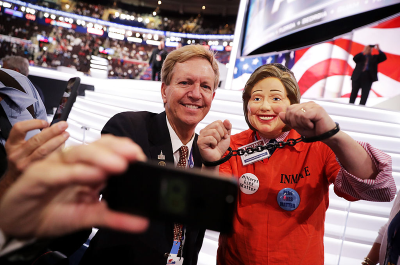 Wes Nakagiri, wears a Hillary Clinton mask at the Republican National Convention (Photo by Joe Raedle/Getty Images)